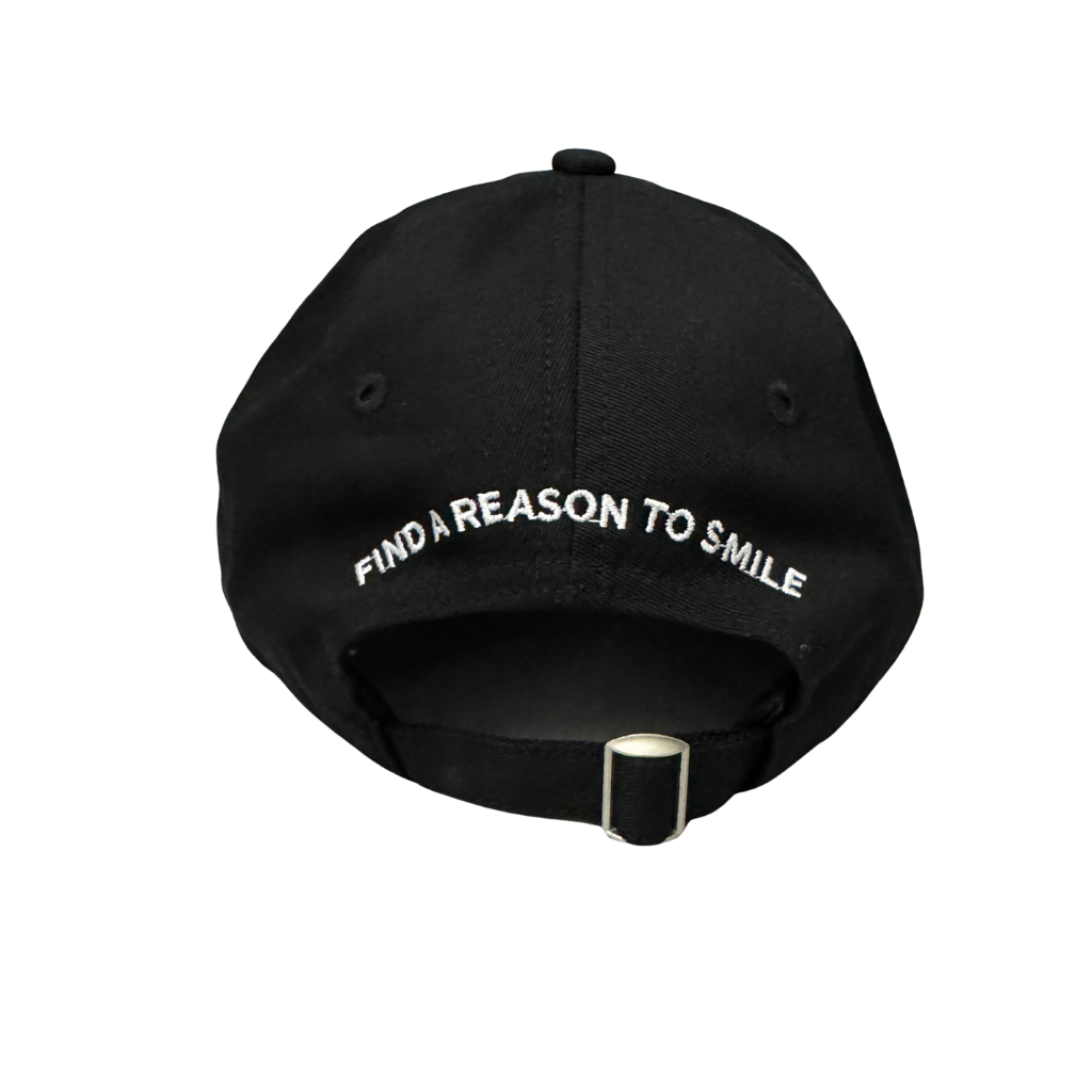 Back view of Dad Hat with curved text reading “Find A Reason To Smile”