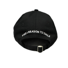 Back view of Dad Hat with curved text reading “Find A Reason To Smile”